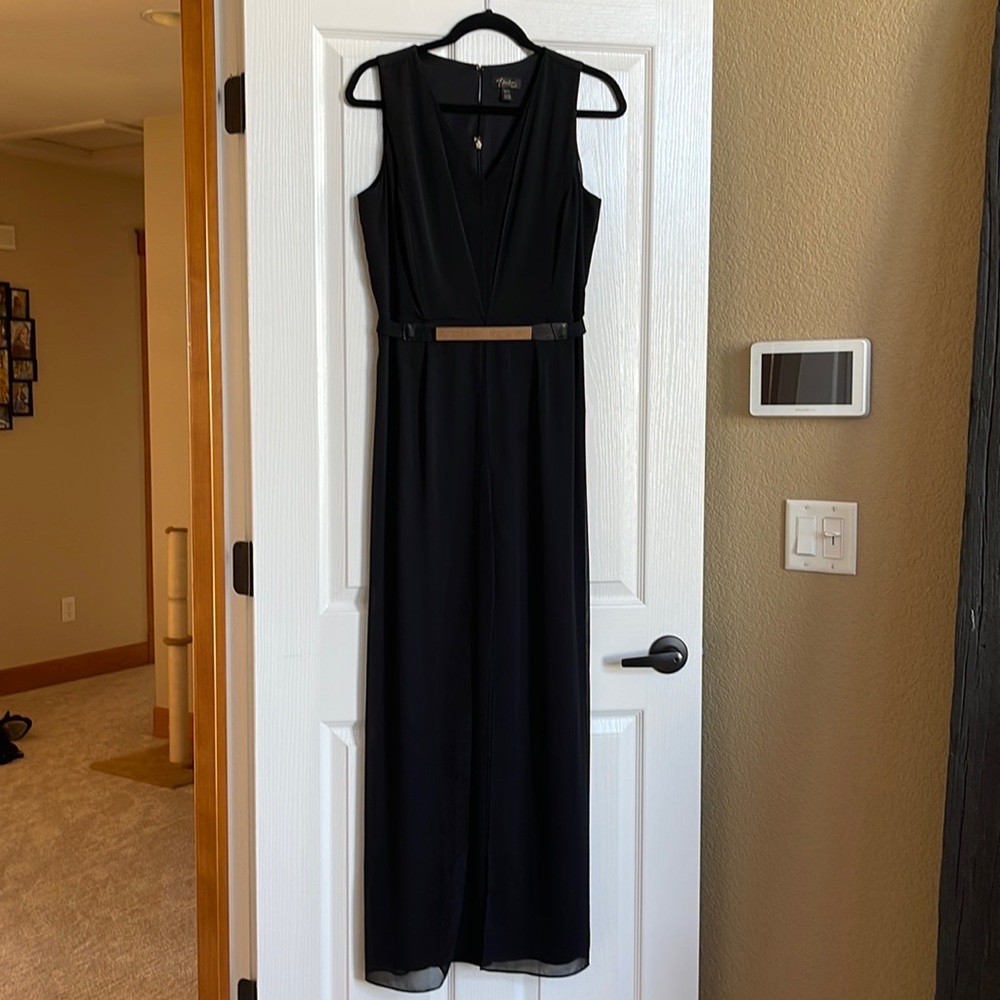 Black jumpsuit with gold belt and chiffon detail